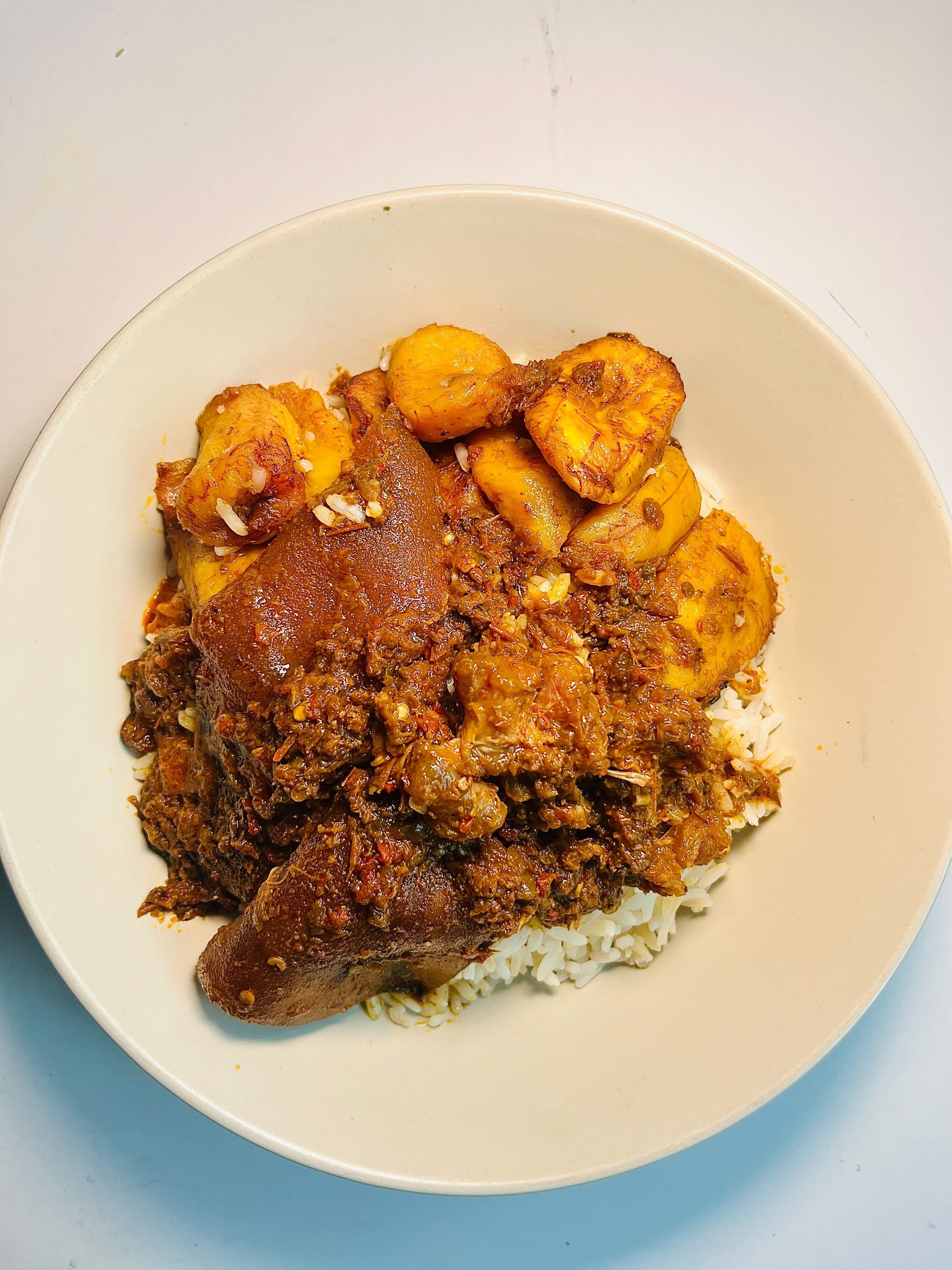 white rice and beans with ofada sauce